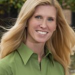 Smiling Christine Grier in green shirt