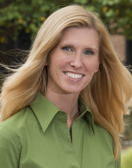 Smiling Christine Grier  in green shirt