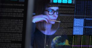 Student looking at computer with lines of data superimposed