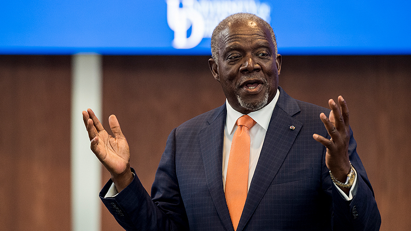 Haiti Ambassador Hervé H. Denis speaking with extended open hands