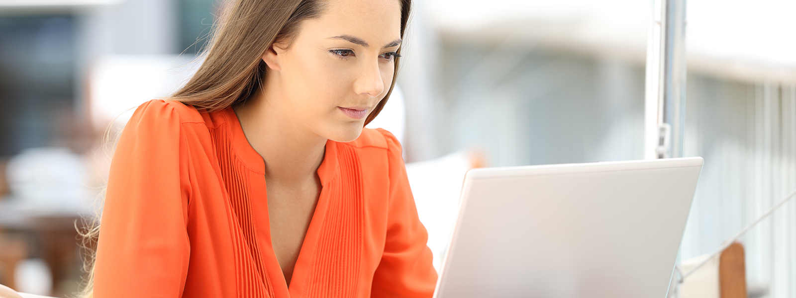 Female student looking at laptop screen