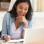 woman at computer working on test prep