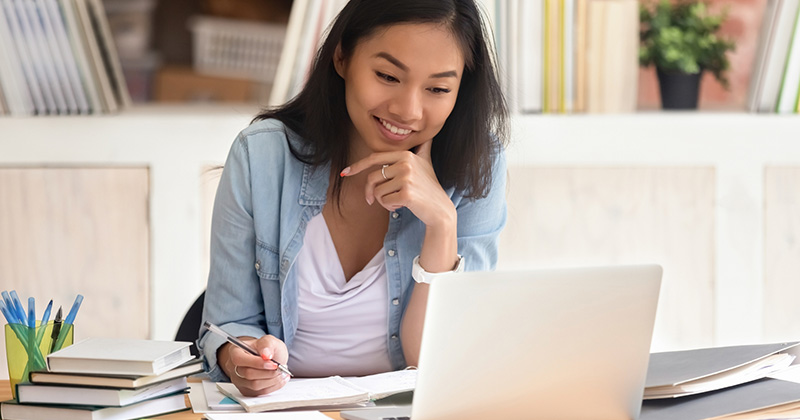 woman at computer working on test prep