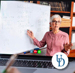 Woman explaining math problem at dry erase board with title "GRE, GMAT and LSAT Strategy Workshops and Test Prep Courses"